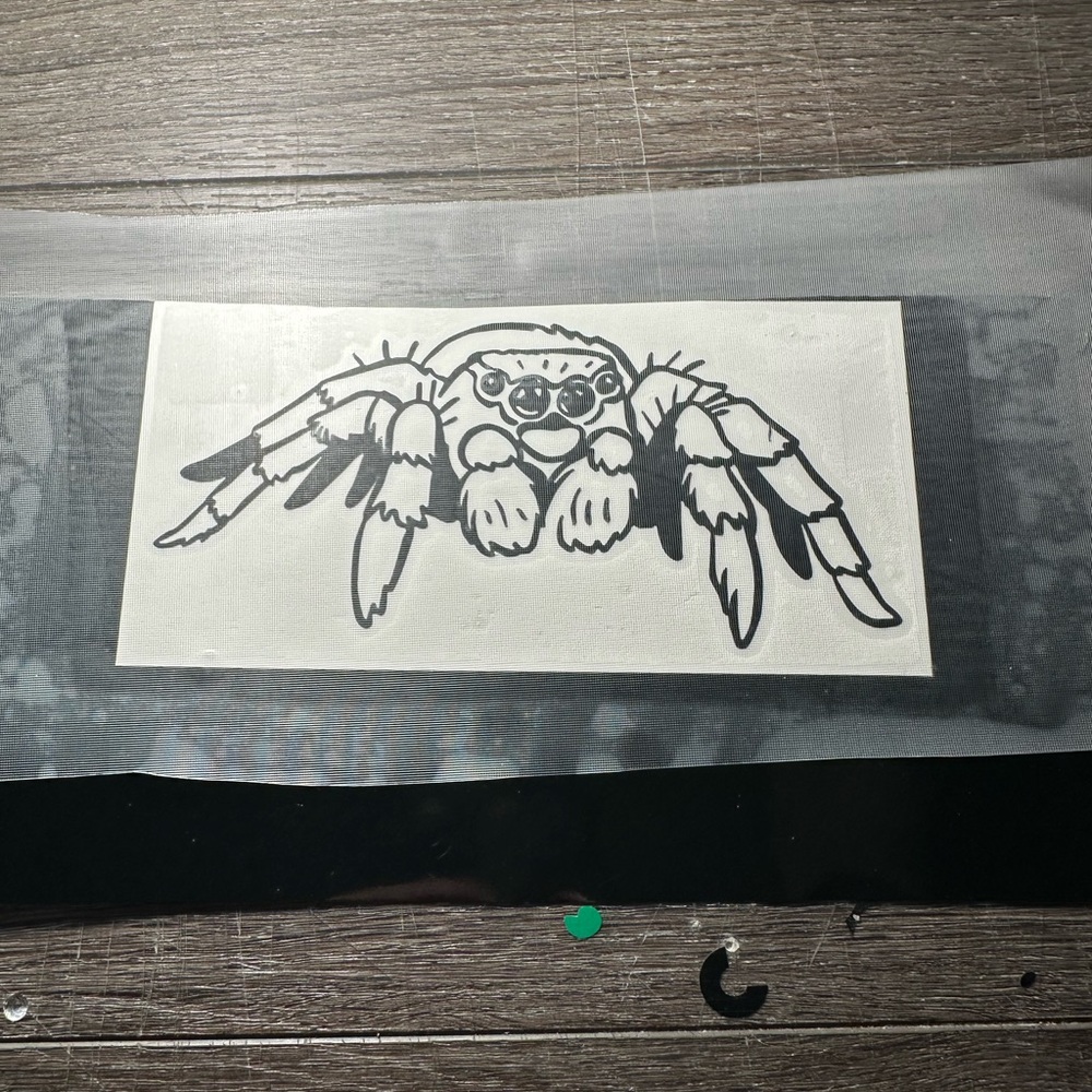 Jumping Spider Decal - Black 
Size 6”x 3”
Waterproof